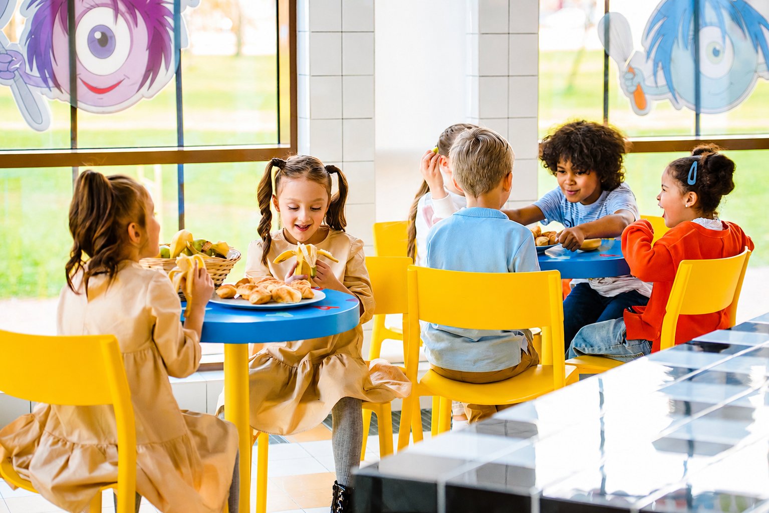 Children sharing a meal together in a school canteen